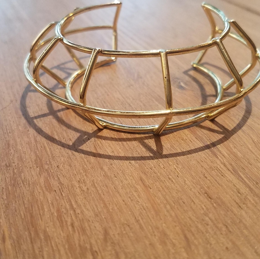 Cylindrical cage gold metal bracelet
